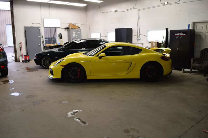 Yellow Porsche Cayman GT4