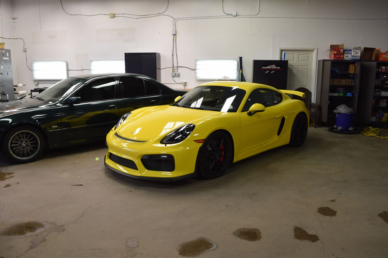 Yellow Porsche Cayman GT4