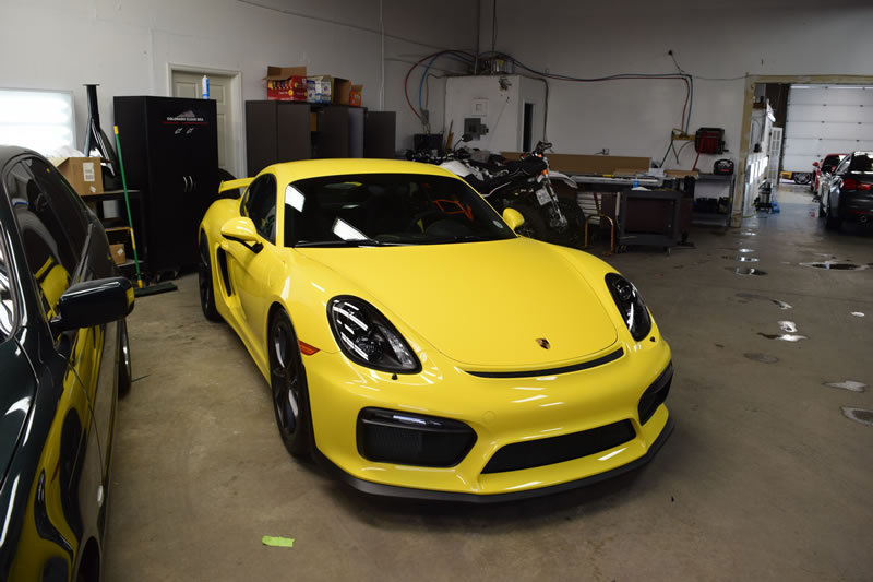 Yellow Porsche Cayman GT4