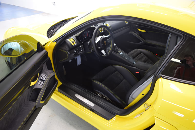 Yellow Porsche Cayman GT4