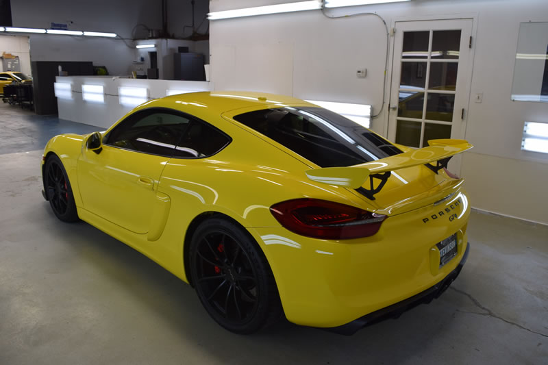 Yellow Porsche Cayman GT4