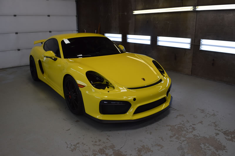 Yellow Porsche Cayman GT4