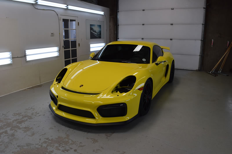 Yellow Porsche Cayman GT4