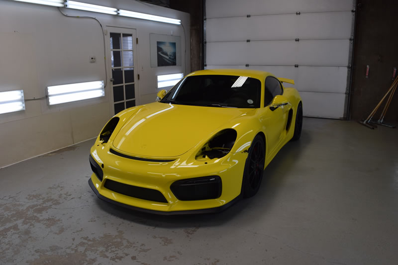 Yellow Porsche Cayman GT4