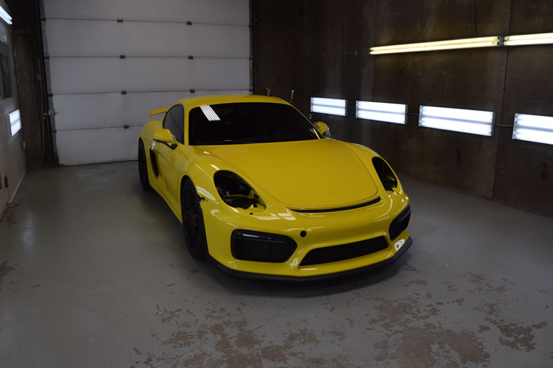 Yellow Porsche Cayman GT4