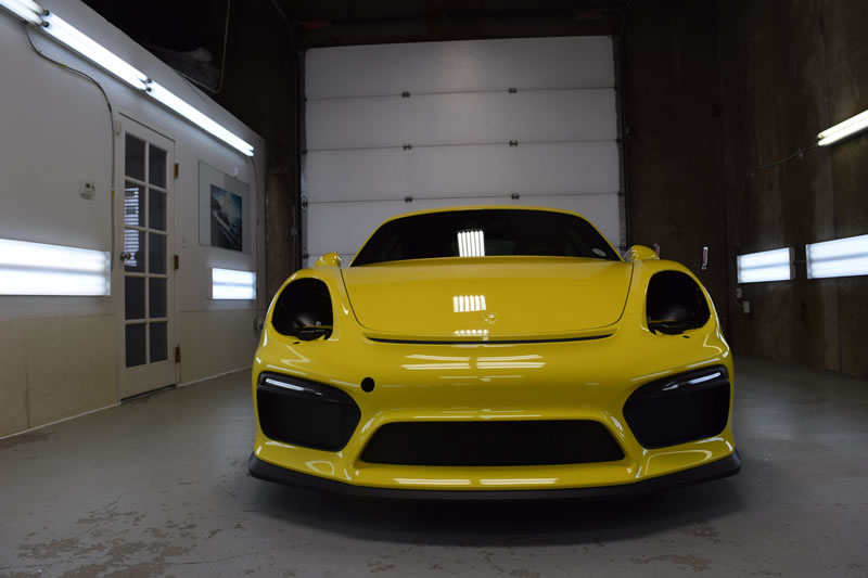 Yellow Porsche Cayman GT4