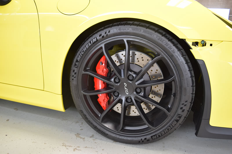 Yellow Porsche Cayman GT4