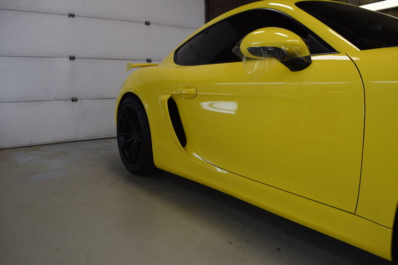 Yellow Porsche Cayman GT4