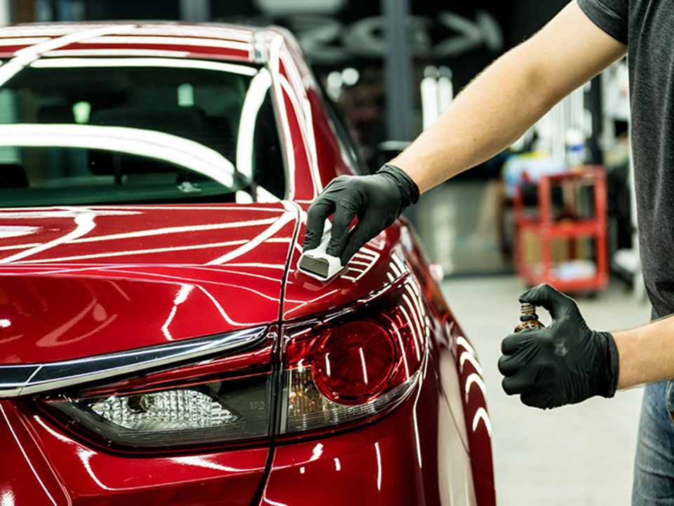 Applying Nano Coating on Red Car