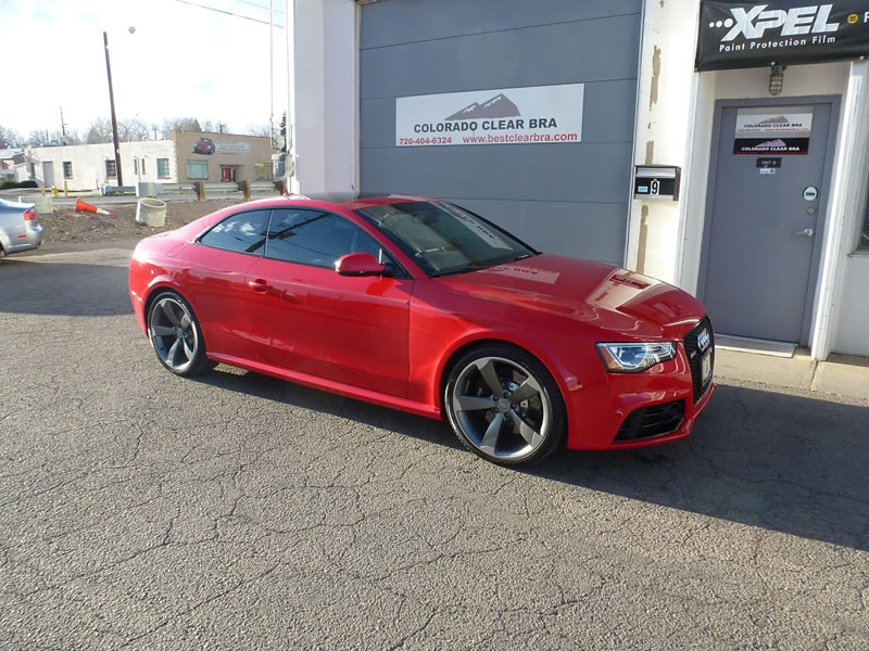 Red Audi RS5 in front of shop