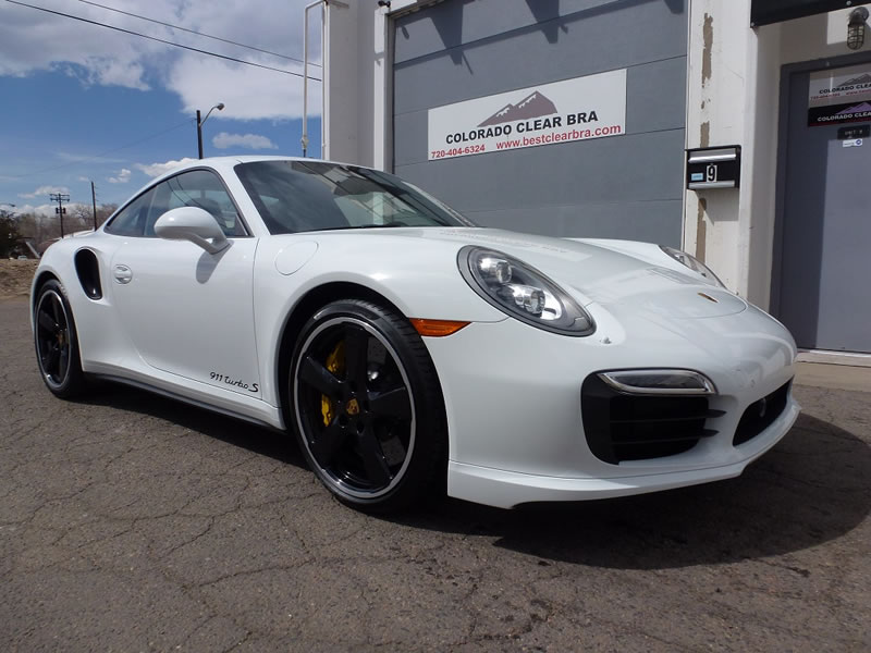 White Porsche 911 outside of shop