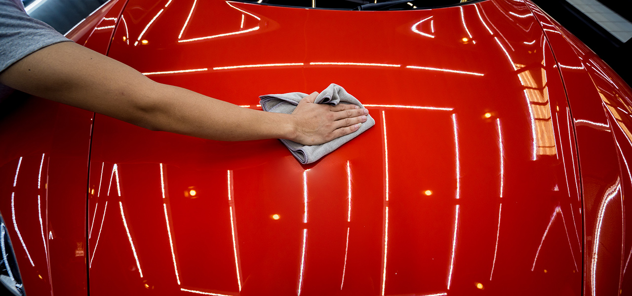 Applying Nano Coating on Red Car in Denver