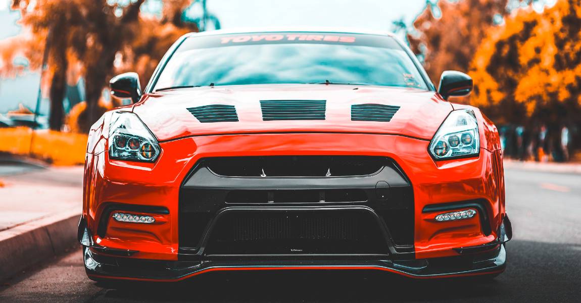 Hybrid car window tint films on red car