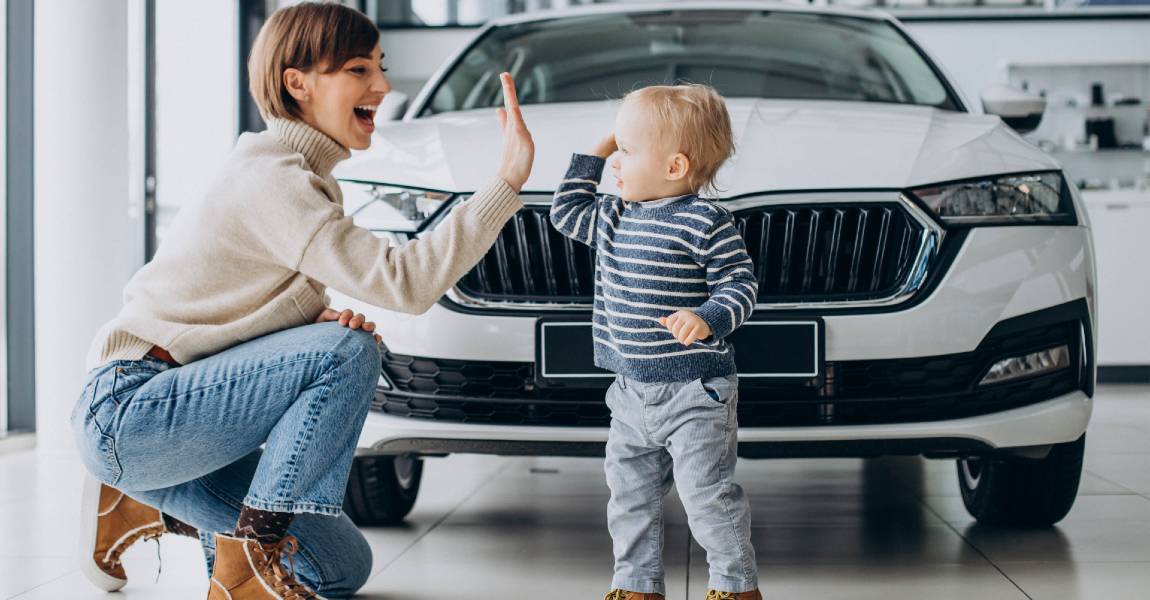 white ceramic coated car with woman and baby
